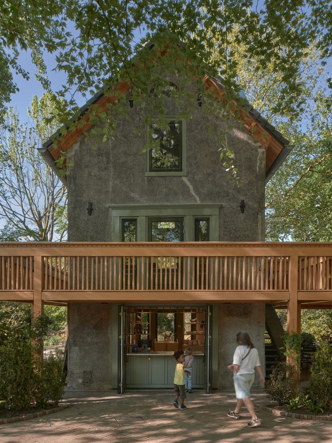 Architectural project - green accents, house exterior, welcoming entrance, shaded area, charming house, restoration, classic design, rustic house, relaxing atmosphere, plaster exterior, wooden balcony, wood, timber, outdoor space, natural light, warm tones, green, neutral tones, brown, eco friendly, natural setting, rustic charm, tranquil setting, ecological design, earth tones, biophilic design, sustainable home, home facade, cozy vibe, countryside home, nature-inspired, child friendly, garden view, traditional style, textured walls, rural vibe, nature integration, green design, countryside living, garden path, rural retreat, home renovation, family-friendly