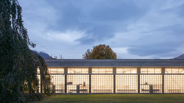 Architectural project - rectangular shape, peaceful environment, passive lighting, crisp lines, blending with nature, industrial materials, simple geometry, grid pattern, concrete building, mountain backdrop, office building, evening view, low rise, broad windows, structural clarity, quiet aesthetic, eco-friendly design, natural light, glass, natural tones, contemporary style, grey, daylight, concrete, exterior design, minimalist facade, industrial style, functional design, minimalist design, neutral colors, sustainable building, workspace, landscape integration, clean lines, white, modern architecture, outdoor view, open plan, serene setting, urban architecture, glass facade, clean design, organized space, office space