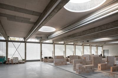 Architectural project - flexible space, light grey, warehouse style, modern industrial, workspace design, unfinished look, concrete ceiling, brick material, concrete material, brick walls, glass block walls, warehouse conversion, industrial beams, engineered beams, geometric light, renovation space, minimal design, sustainable materials, grey tones, raw materials, natural light, passive design, eco design, exposed beams, daylight, low carbon design, neutral palette, multifunctional, adaptable space, industrial chic, natural ventilation, open layout, open plan, bright interior, airy atmosphere, structural elements, contemporary vibe, industrial space, skylight, modular elements