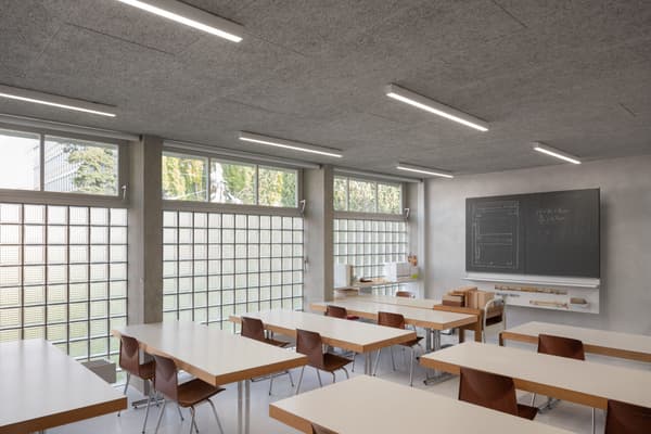Architectural project - grid windows, minimalist furniture, timber desk, classroom, educational, school room, modern classroom, glass block windows, wood desk, sleek chairs, student chairs, teaching board, chalkboard, blackboard, white desks, brown chairs, study environment, academic setting, low energy, minimalist learning, natural light, passive design, sustainable design, modern vibe, neutral tones, daylight, light wood, functional design, daylight optimization, eco friendly, minimalist vibe, contemporary design, neutral palette, minimalist design, neutral colors, clean lines, large windows, plaster wall, beige tones, open plan, study area, bright interior, simple decor, efficient layout, open space, educational space, learning space, wooden furniture, modern education, learning environment, concrete wall, bright room