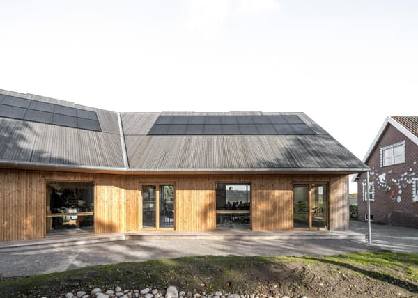 Architectural project - solar panel, solar panels, wood building, natural materials, wood, timber, raw materials, outdoor space, rustic touch, passive design, sustainable design, glass, natural tones, grey, minimalist facade, low carbon design, daylight optimization, modern design, farmhouse style, rural architecture, simple design, organic design, contemporary design, Scandinavian style, neutral palette, timber building, green architecture, sustainable home, natural ventilation, landscape integration, clean lines, timber cladding, wood cladding, Nordic design, eco friendly home, countryside home, energy efficient, wood texture, earthy tones, exterior view, eco architecture, wooden facade, sustainable facade, energy saving, modern rural, facade design, natural look, eco facade