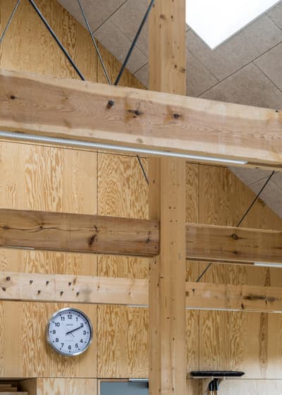 Architectural project - open ceiling, rustic feel, loft vibe, natural aesthetic, natural materials, industrial design, raw materials, natural light, sustainable design, warm tones, green building, timber structure, functional space, daylight, light wood, engineered wood, eco friendly, wood beams, rustic modern, industrial touch, minimalist style, neutral palette, warm wood, exposed wood, modern rustic, biophilic design, textured surface, passive house, wood cladding, Nordic style, beige tones, structural element, wood texture, cozy atmosphere, Scandinavian design, bright interior, cozy vibes, interior space, timber wall, spacious feel, minimalist interior, high ceiling, architectural feature, wood interior