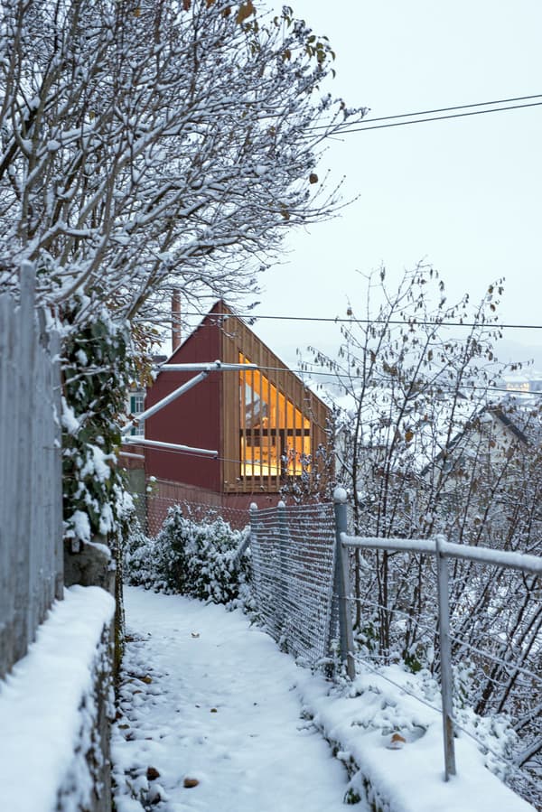 Architectural project - warm glow, rustic setting, modern barn, wood, timber, outdoor living, sustainable design, warm tones, evening light, beige, wood facade, timber facade, light wood, natural setting, farmhouse style, rural architecture, Scandinavian vibe, wood cladding, white, Nordic design, inviting home, outdoor view, cozy cabin, cozy atmosphere, nature retreat, rural setting, barn style, countryside living, minimalist exterior, eco retreat, modern cottage, architectural contrast, red