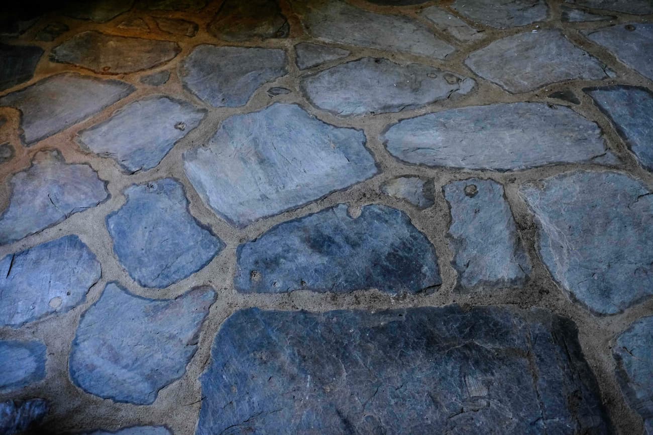 Architectural project - eco friendly material, natural stone, gray, old-world charm, rustic floor, earthy, natural landscaping, outdoor flooring, pathway design, stone paving, sustainable flooring, hardscape, natural pattern, rugged look, natural materials, outdoor space, warm tones, neutral tones, beige, exterior design, blue, organic design, rustic charm, sand, textured surface, stone, stonework, earthy tones, traditional design, landscape design, stone floor, garden path, country home, stone texture