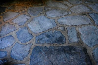 Architectural project - eco friendly material, natural stone, gray, old-world charm, rustic floor, earthy, natural landscaping, outdoor flooring, pathway design, stone paving, sustainable flooring, hardscape, natural pattern, rugged look, natural materials, outdoor space, warm tones, neutral tones, beige, exterior design, blue, organic design, rustic charm, sand, textured surface, stone, stonework, earthy tones, traditional design, landscape design, stone floor, garden path, country home, stone texture