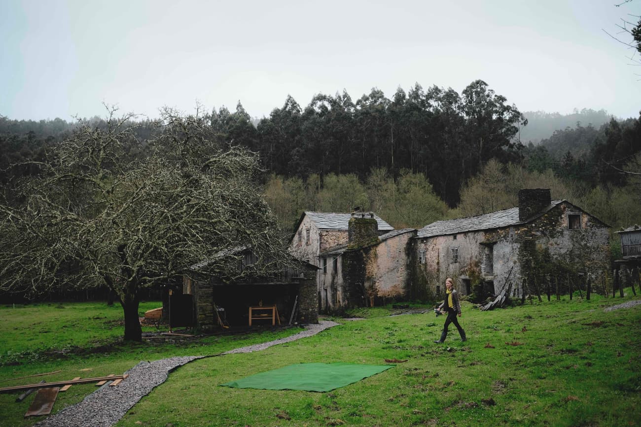 Architectural project - eco living, rural landscape, rustic setting, garden area, country house, old-world charm, historic vibe, heritage style, pastoral setting, farmhouse, weathered stone, natural path, stone path, large garden, pathway, stone house, rural environment, natural materials, outdoor space, outdoor living, natural tones, grey, green, brown, eco friendly, rustic charm, cozy vibe, stone, traditional architecture, quiet retreat, nature retreat, countryside, heritage building, traditional style, rustic home, lush greenery, peaceful atmosphere, green space, natural surroundings, sustainable living