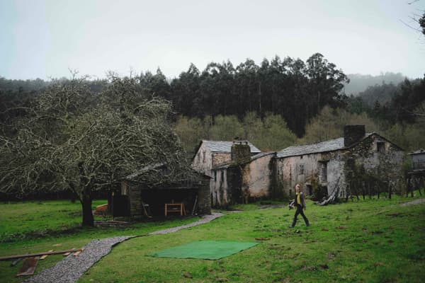 Architectural project - eco living, rural landscape, rustic setting, garden area, country house, old-world charm, historic vibe, heritage style, pastoral setting, farmhouse, weathered stone, natural path, stone path, large garden, pathway, stone house, rural environment, natural materials, outdoor space, outdoor living, natural tones, grey, green, brown, eco friendly, rustic charm, cozy vibe, stone, traditional architecture, quiet retreat, nature retreat, countryside, heritage building, traditional style, rustic home, lush greenery, peaceful atmosphere, green space, natural surroundings, sustainable living