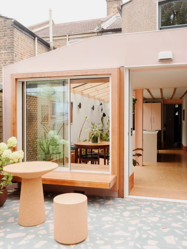 Architectural project - terrace, brick wall, dining room, exposed brick, home extension, modern extension, fresh vibe, patio doors, terrazzo floor, garden room, pastel pink, natural materials, pink, timber, timber frame, relaxed vibe, natural light, sustainable design, warm tones, contemporary architecture, daylight, plywood, beige, light wood, eco friendly, wood beams, timber beams, Scandinavian style, minimalist design, glass doors, indoor outdoor, modern architecture, wood frame, open layout, open plan, dining area, inviting space, cozy atmosphere, residential design, greenery, Nordic influences, family home, bright space, sliding doors, soft colors, courtyard, renovation, indoor plants