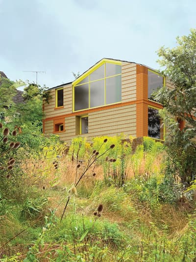 Architectural project - brick wall, green facade, vibrant facade, suburban living, warm facade, yellow accent, urban house, timber, outdoor space, glass, eco design, green, daylight optimization, eco friendly, outdoor, architectural texture, light brown, exterior, low carbon, biophilic design, sustainable home, passive house, natural ventilation, contemporary home, large windows, timber cladding, earthy tones, pitched roof, brick, garden view, residential architecture, gable roof, nature integration, glass windows, textured facade, residential, urban garden, modern house, inviting facade