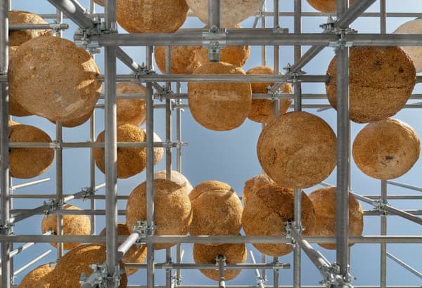 Architectural project - sky, urban art, public art, creative installation, art installation, modern art, natural materials, architectural detail, scaffolding, metal frame, steel, sustainable design, warm tones, modular design, eco design, industrial aesthetic, innovative design, architectural installation, beige, brown, geometric pattern, open structure, outdoor structure, lightweight structure, steel frame, minimalist structure, low carbon, earth tones, natural texture, sky view, visual interest, organic shapes