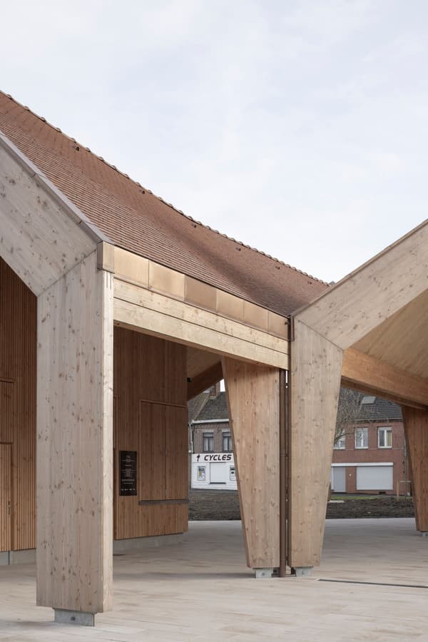 Architectural project - simple geometry, vernacular style, architectural beams, public pavilion, natural materials, architectural detail, sustainable materials, wood, timber, natural light, passive design, warm tones, modular design, eco design, exposed structure, community space, sustainable architecture, neutral tones, timber structure, daylight, beige, concrete, timber facade, light wood, open structure, wooden beams, honey wood, contemporary design, minimalist design, outdoor pavilion, public space, gathering area, raw wood, modern pavilion, wood structure, circular design, wood cladding, modern architecture, Nordic style, eco-friendly building, Scandinavian design, low carbon architecture
