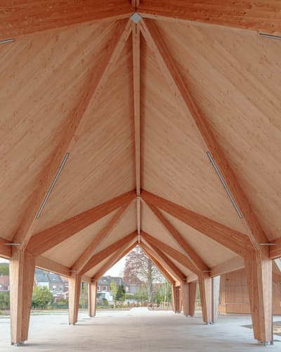 Architectural project - simple aesthetic, open air space, resilient design, minimal design, natural materials, wood, timber, natural light, passive design, sustainable design, warm tones, natural tones, eco design, exposed structure, contemporary style, neutral tones, daylight, wooden ceiling, beige, brown, light wood, open design, eco friendly, Scandinavian influence, wooden beams, timber construction, honey wood, timber beams, neutral palette, community hub, outdoor pavilion, public space, gathering area, pavilion, urban design, raw wood, wood structure, landscape integration, timber cladding, modern architecture, timber ceiling, inviting space, wooden facade, bright space, nordic influence, structural rhythm