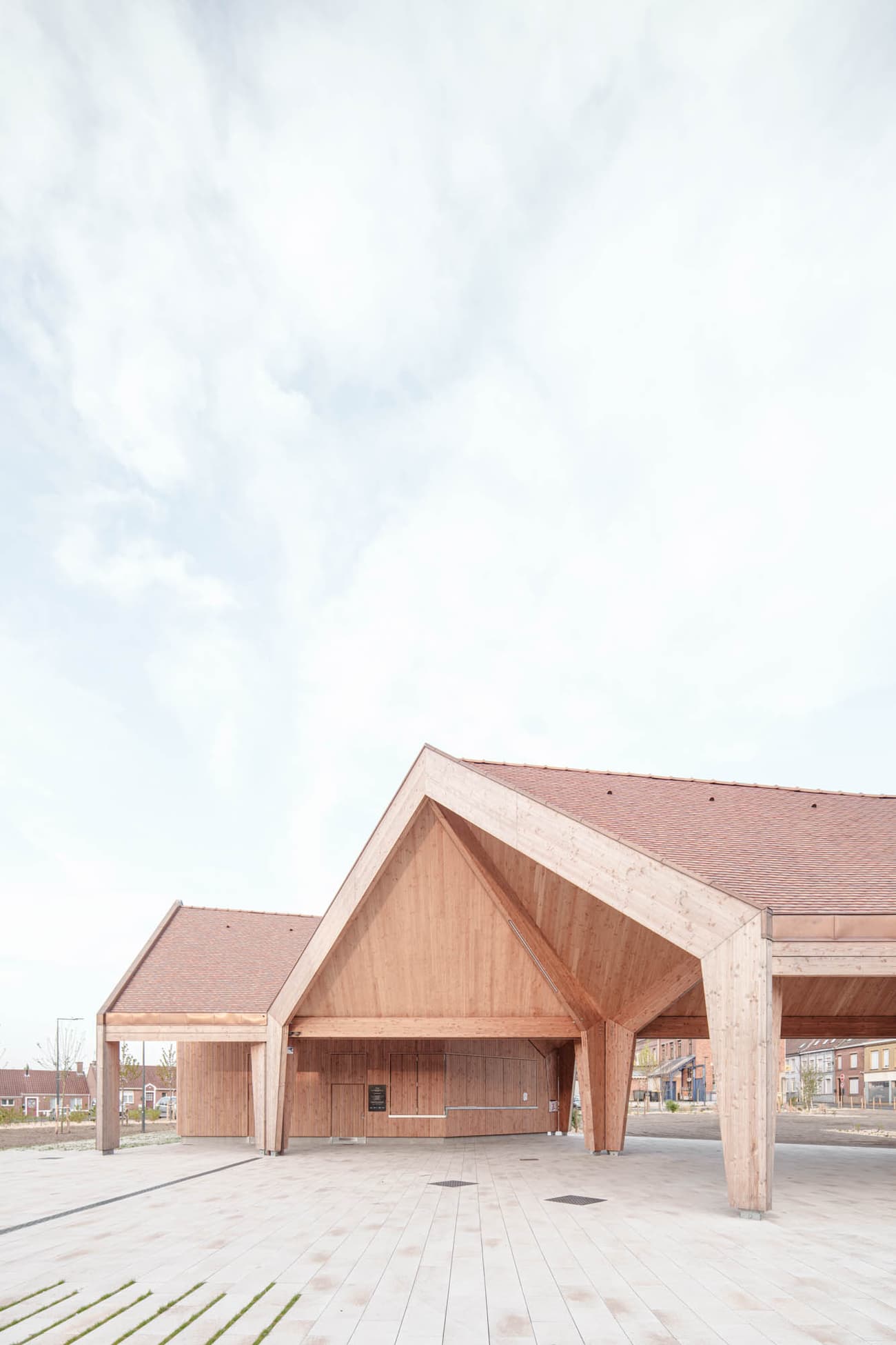 Architectural project - gathering place, timber pavilion, architectural landmark, contextual design, architectural beams, timber canopy, wood design, natural materials, design focus, timber, raw materials, sustainable design, warm tones, natural tones, community space, exposed beams, spacious layout, beige, wood facade, timber facade, roof detail, light wood, eco friendly, open structure, eco structure, timber construction, Scandinavian style, light brown, neutral palette, minimalist design, outdoor pavilion, public space, event space, wood construction, natural finish, CLT, landscape integration, clean lines, white, modern architecture, Nordic style, airy space, pitched roof, natural aesthetics, gable roof, bright space, wooden structure, innovative architecture