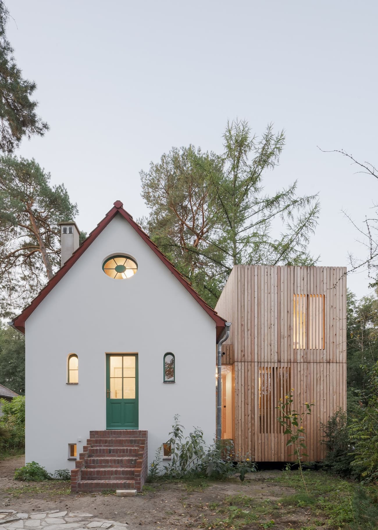 Architectural project - small house, minimalist windows, cottage, wood extension, scenic house, charming house, inviting house, natural materials, wood, timber, natural tones, eco design, simple structure, sustainable architecture, neutral tones, beige, airy design, rustic modern, contemporary design, biophilic design, sustainable home, scenic view, white facade, large windows, timber cladding, bright exterior, white, pitched roof, forest setting, residential design, garden view, warm vibe, nature integration, countryside living, wooden facade, modern cottage, open space, cozy home, vertical cladding, connection to nature, home renovation, compact home