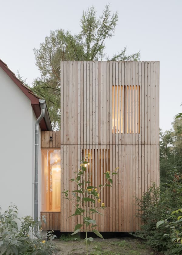 Architectural project - architectural statement, modern extension, wood extension, residential extension, wood building, house extension, architectural addition, seamless blend, clear lines, wood, timber, natural light, sustainable design, glass, warm tones, grey, neutral tones, daylight, beige, wood facade, timber facade, light wood, natural setting, contemporary design, timber panels, timber architecture, biophilic design, clean lines, timber cladding, nature-inspired, environmental design, outdoor connection, nature integration, forest house, eco architecture, wooden panels, minimalist exterior, modern style, green surroundings, vertical cladding, vertical slats, unique design