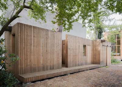 Architectural project - linear design, natural retreat, compact structure, outdoor walkway, retreat, calm environment, woodland architecture, timber walkway, secluded cabin, woodland escape, understated style, serene vibe, natural materials, eco-friendly design, wood, timber, outdoor space, passive design, warm tones, green building, wood facade, timber facade, light wood, honey wood, natural textures, peaceful setting, minimalist design, relaxed atmosphere, sustainable building, timber architecture, low carbon, biophilic design, clean lines, timber cladding, energy efficient, rustic cabin, earthy tones, nature-inspired, forest setting, natural environment, eco cabin, nature integration, vertical cladding, simple lines, wooden exterior, modern cabin, small footprint