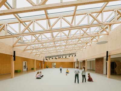 Architectural project - eco-friendly design, wood, timber, natural light, eco-conscious, glass, warm tones, green building, contemporary architecture, neutral tones, timber structure, daylight, beige, light wood, modern aesthetic, functional design, recreational space, wood beams, Scandinavian style, gathering area, community center, sustainable building, light filled, timber cladding, Nordic design, landscape view, inviting space, spacious interior, airy atmosphere, educational space, skylight, minimalist interior, play area, family-friendly, wooden walls