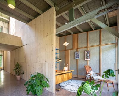 Architectural project - retro vibe, raw textures, indoor garden, cozy office, armchair, terrazzo floor, casual workspace, vintage chair, minimal design, calming atmosphere, natural materials, wood, timber, metal, relaxed vibe, natural light, sustainable design, warm tones, green, neutral tones, daylight, beige, brown, concrete, light wood, natural wood, eco friendly, honey wood, Scandinavian style, timber walls, modern rustic, Nordic style, plaster, open plan, inviting space, organic materials, greenery, textured walls, green design, reading nook, home office, bright space, wood paneling, indoor plants, wooden walls, wood interior, exposed ceiling, office space