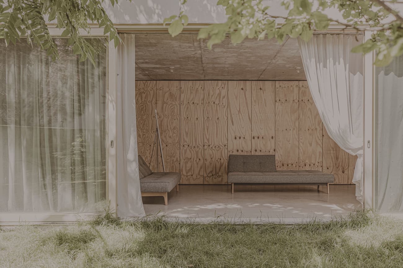 Architectural project - natural retreat, transitional space, calm space, wooden wall, minimal design, natural materials, soft lighting, relaxation area, raw materials, natural light, bohemian style, sustainable design, eco design, neutral tones, daylight, beige, light wood, honey wood, natural textures, rustic charm, soothing atmosphere, Scandinavian style, zen space, glass doors, plywood wall, circular design, passive house, indoor outdoor, cozy nook, green living, airy space, timber cabin, open plan, earthy tones, garden view, wooden cabin, eco cabin, peaceful vibe, lounge area, sliding doors, open space, greenery view, interior design, timber wall, simple furniture, warm palette, Japandi style, home retreat, modern retreat, minimalist interior