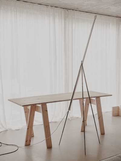 Architectural project - creative studio, artistic vibe, subtle elegance, minimalist furniture, wood table, sheer curtains, minimalist room, creative workspace, peaceful room, soft lighting, wood, timber, steel, natural light, contemporary style, grey, neutral tones, beige, light wood, functional design, calming interior, Scandinavian style, neutral palette, minimalist design, tranquil setting, clean lines, elegant design, white, Nordic design, warm ambiance, airy space, wooden table, earthy tones, cozy corner, home office, minimalist aesthetic, bright space, simple decor, modern interior, spacious feel