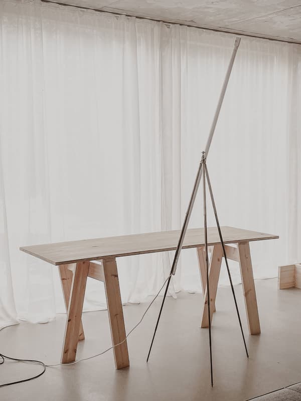 Architectural project - creative studio, artistic vibe, subtle elegance, minimalist furniture, wood table, sheer curtains, minimalist room, creative workspace, peaceful room, soft lighting, wood, timber, steel, natural light, contemporary style, grey, neutral tones, beige, light wood, functional design, calming interior, Scandinavian style, neutral palette, minimalist design, tranquil setting, clean lines, elegant design, white, Nordic design, warm ambiance, airy space, wooden table, earthy tones, cozy corner, home office, minimalist aesthetic, bright space, simple decor, modern interior, spacious feel