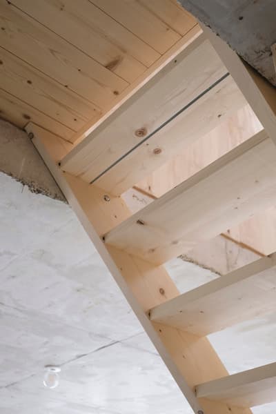 Architectural project - exposed timber, minimalist stairs, loft style, unfinished look, cozy feel, airy interior, ceiling detail, plywood finish, renovation project, plywood construction, natural materials, wood elements, sustainable materials, raw materials, warm tones, eco design, neutral tones, structural timber, light wood, natural wood, functional design, eco friendly, compact space, simple design, rustic vibe, industrial touch, Scandinavian style, neutral palette, natural finish, warm wood, exposed wood, modern rustic, sustainable home, clean lines, timber ceiling, warm ambiance, textured wood, light timber, bright space, timber framing, nordic influence, cozy home, pale wood, wooden staircase, minimalist interior, timber steps