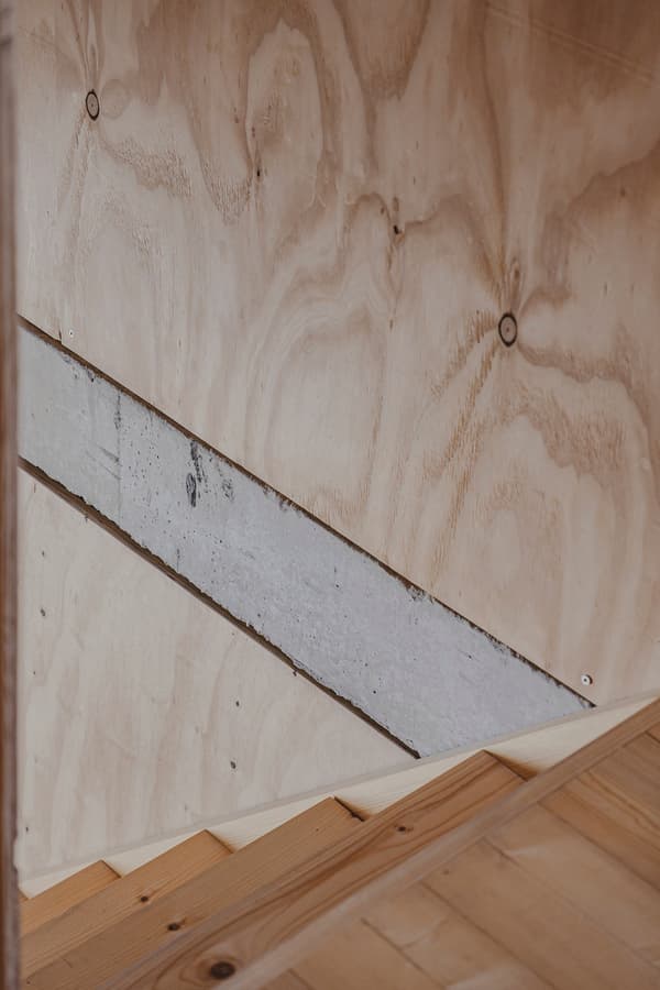 Architectural project - geometric lines, smooth texture, structured space, cozy interior, indoor space, architectural detail, wood, timber, warm tones, natural tones, eco design, sustainable architecture, plywood, beige, light wood, natural wood, modern aesthetic, simple design, Scandinavian style, neutral palette, minimalist design, clean aesthetic, plywood wall, clean lines, Nordic design, cozy vibe, small space, warm atmosphere, sustainable material, modern home, wooden texture, interior design, wooden staircase, timber wall, understated elegance, wood panel, timber steps, wood interior
