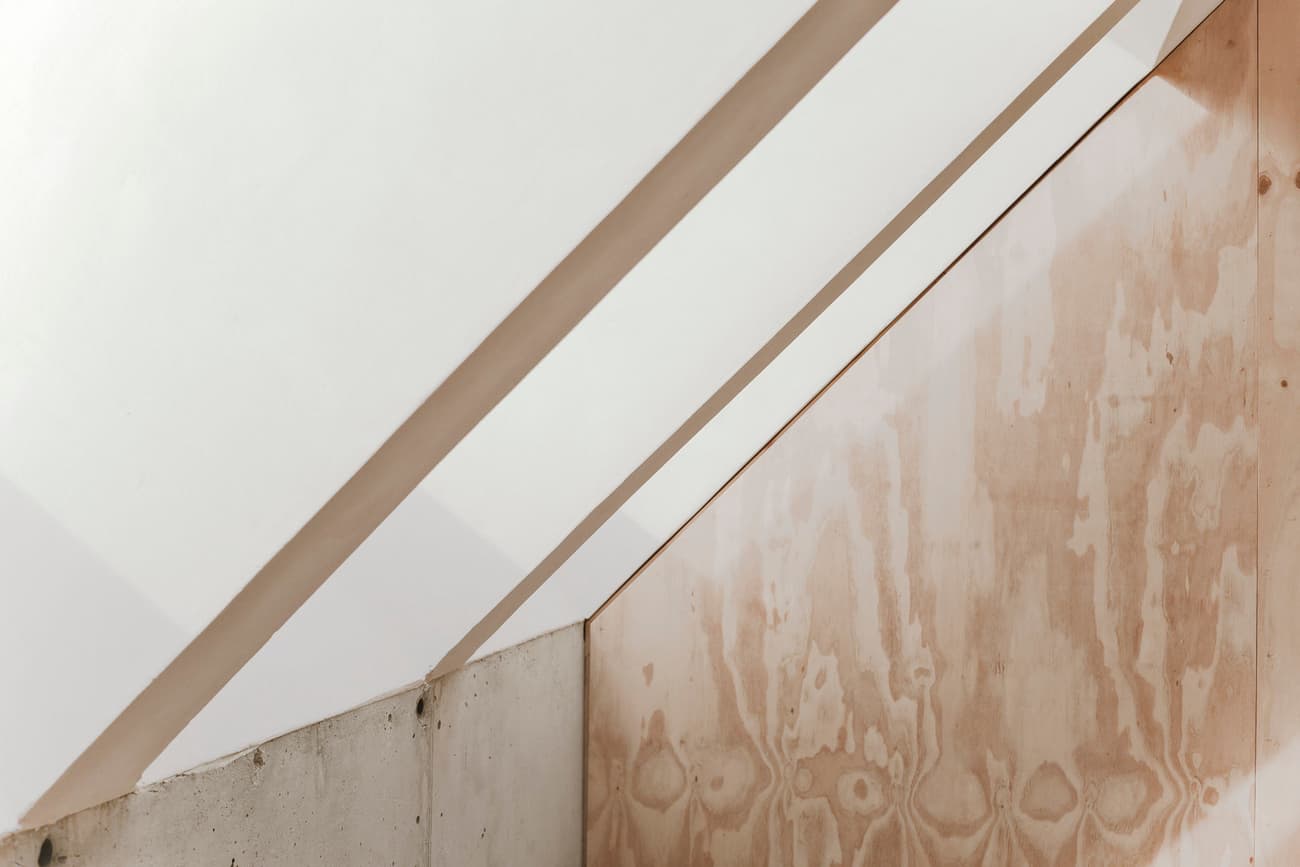 Architectural project - bright light, aesthetic space, light atmosphere, artistic wall, subtle textures, architectural detail, sustainable materials, raw materials, natural light, shadow play, warm tones, eco design, plywood, beige, concrete, light and shadow, architectural photography, Scandinavian influence, minimalist vibe, contemporary design, modern simplicity, minimalist design, modern aesthetics, plywood wall, modern minimalism, clean lines, white, textured wall, plaster wall, plaster, soft tones, airy feel, serene interior, concrete wall, Japandi style