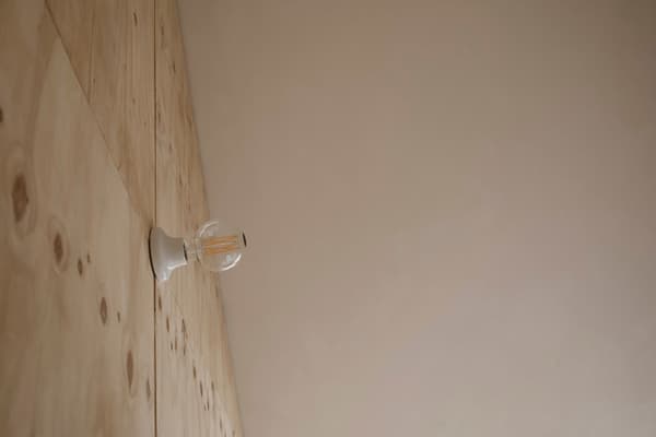 Architectural project - subtle elegance, wooden wall, modern lighting, minimalist lighting, wall sconce, minimal design, cozy interior, warm interior, calming atmosphere, natural materials, wood, timber, raw materials, sustainable design, warm tones, eco design, plywood, beige, light wood, simple design, serene atmosphere, contemporary design, Scandinavian style, light brown, neutral palette, plywood wall, earthy texture, clean lines, wood cladding, Nordic design, plaster, timber interior, inviting space, warm colors, natural texture, simple forms, warm vibe, beige wall, modern interior, smooth finish