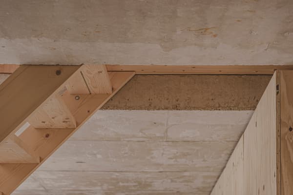 Architectural project - exposed concrete, unfinished look, concrete ceiling, ceiling detail, wood beam, timber beam, construction material, wood, timber, raw materials, warm tones, eco design, sustainable construction, grey, neutral tones, structural timber, modern construction, industrial vibe, beige, brown, concrete, light wood, natural wood, timber construction, simple design, minimalist design, natural finish, exposed wood, construction detail, building material, modern rustic, rustic style, architectural element