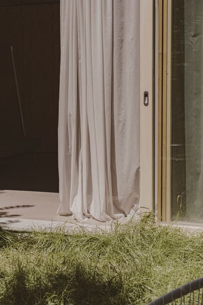 Architectural project - harmony with nature, minimalist living, sheer curtains, calming atmosphere, natural materials, tranquil space, wood, timber, relaxed vibe, natural light, glass, eco design, green, beige, light wood, personal retreat, Scandinavian style, neutral palette, minimalist design, soft textures, indoor outdoor, simple elegance, white, eco friendly home, inviting home, beige tones, green living, airy space, open plan, residential design, nature connection, earthy elements, garden view, serene setting, residential space, modern home, glass door, sliding doors, fresh air, seamless transition, cozy home, sustainable living, contemporary space, warm aesthetic, wooden door, uncluttered space