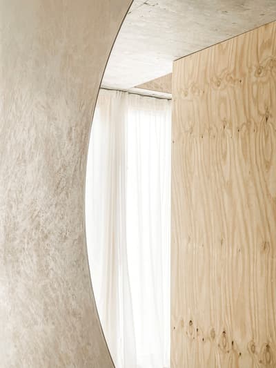Architectural project - simple aesthetic, daylight design, calm environment, warm interior, natural materials, architectural detail, sustainable materials, timber, natural light, plywood, beige, light wood, modern aesthetic, eco friendly, Scandinavian influence, sunlight, serene atmosphere, contemporary design, minimalist style, neutral palette, neutral colors, biophilic design, cozy vibe, textured wall, plaster, airy space, inviting space, plaster finish, residential design, warm vibe, subtle texture, timber panel, bright interior, light and airy, home design, soft tones, curved wall, clean design, modern interior, interior architecture, wood panel, Japandi style, minimalist interior, living space