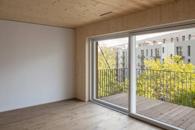 Architectural project - beige walls, outdoor access, balcony access, city view, quiet space, apartment interior, simple interior, natural materials, eco-friendly design, wood, timber, natural light, sustainable design, glass, warm tones, contemporary style, neutral tones, daylight, wooden ceiling, beige, light wood, modern design, honey wood, Scandinavian style, timber floor, wooden floor, glass doors, wood floor, clean lines, white walls, indoor outdoor, white, Nordic style, large window, timber ceiling, airy space, relaxing space, residential space, calm atmosphere, efficient layout, sliding doors, wood ceiling, home interior, open space, wood paneling, timber paneling, minimalist interior, urban view, bright room