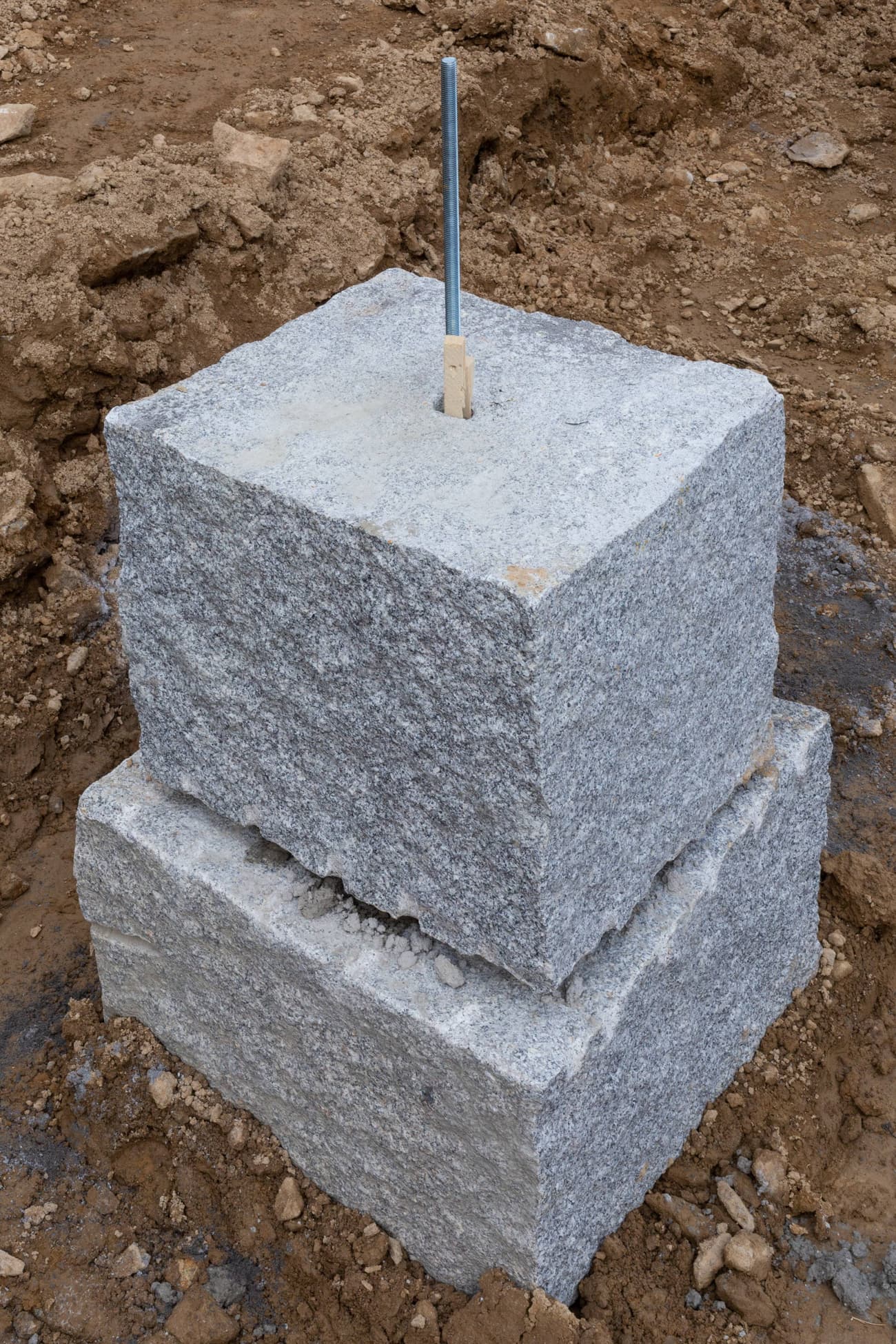 Architectural project - industrial design, raw materials, grey, sustainable construction, construction phase, construction site, modern construction, building construction, construction process, outdoor setting, durable materials, earth tones, architectural details, stone, granite, foundation, concrete base, structural element, rough texture, stable base, strong foundation, foundation block, robust design, natural colors, earthy vibe, excavation site, engineering, stonework, industrial foundation, support structure, ground work, heavy materials, structural integrity, base layer, foundational support, compact design, earth contact, rock solid