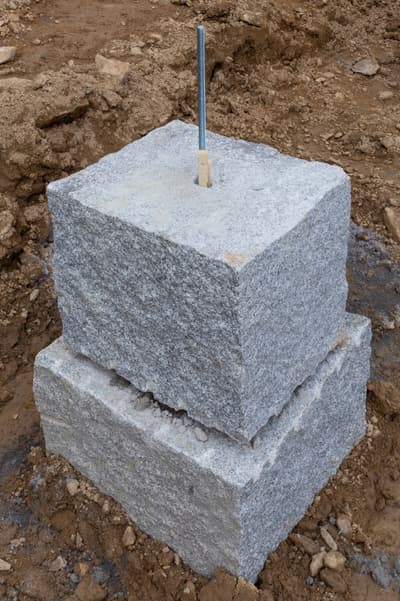 Architectural project - industrial design, raw materials, grey, sustainable construction, construction phase, construction site, modern construction, building construction, construction process, outdoor setting, durable materials, earth tones, architectural details, stone, granite, foundation, concrete base, structural element, rough texture, stable base, strong foundation, foundation block, robust design, natural colors, earthy vibe, excavation site, engineering, stonework, industrial foundation, support structure, ground work, heavy materials, structural integrity, base layer, foundational support, compact design, earth contact, rock solid