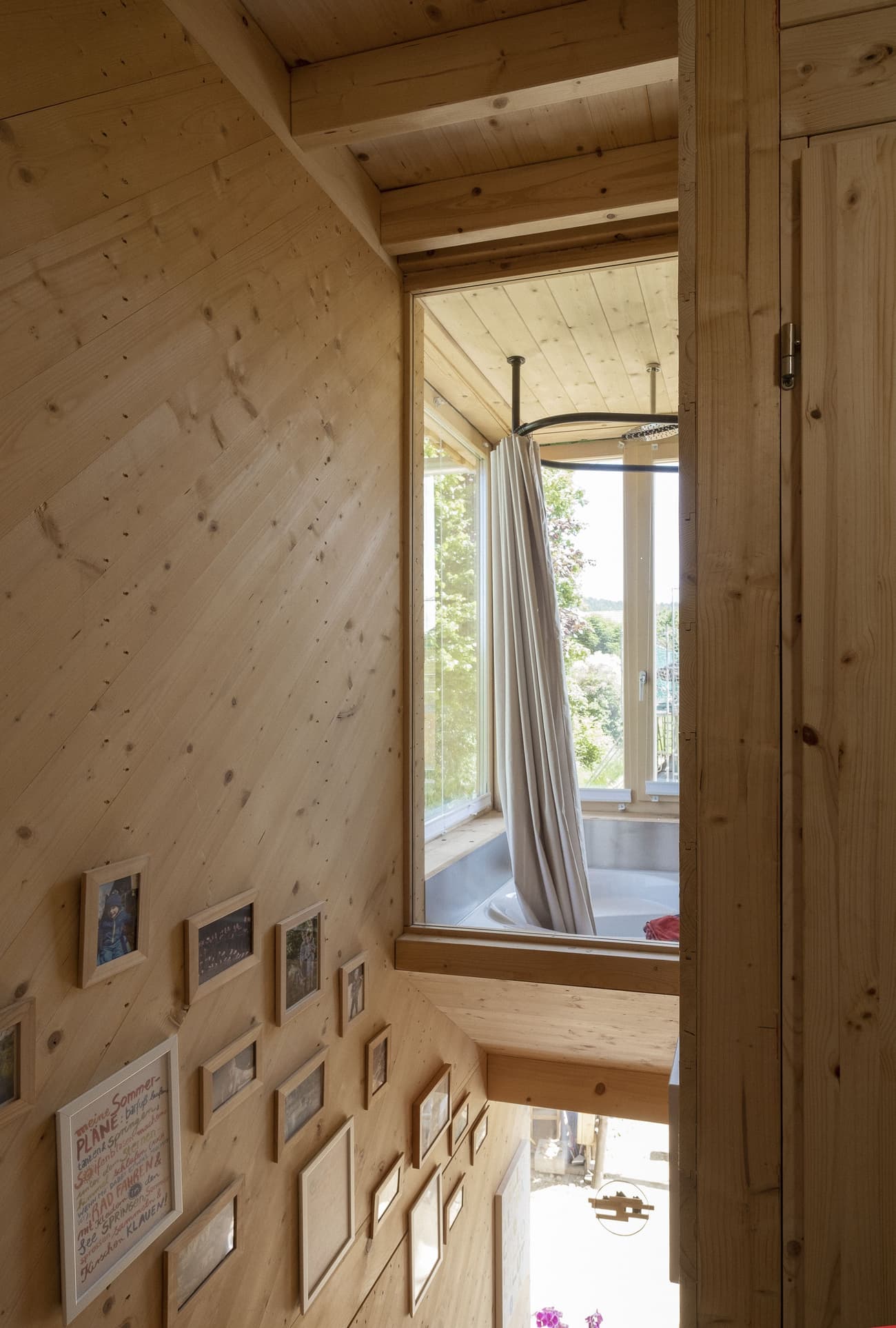 Architectural project - relaxation space, unique window, soft lighting, wood, timber, natural light, eco design, neutral tones, daylight, intimate corner, wooden ceiling, timber ceiling, beige, light wood, compact space, rustic vibe, honey wood, natural textures, Scandinavian style, minimalist style, neutral palette, eco materials, timber walls, biophilic design, sustainable home, scenic view, timber cladding, wood cladding, Nordic design, small window, wooden interior, wood walls, gallery wall, picture frames, framed art, cozy aesthetic, beige tones, curtain partition, small space, cozy nook, private nook, loft bathroom, framed view, home spa, bath retreat, hygge atmosphere, inviting interior, green living, warm ambiance, textured wood, interior charm, rustic warmth