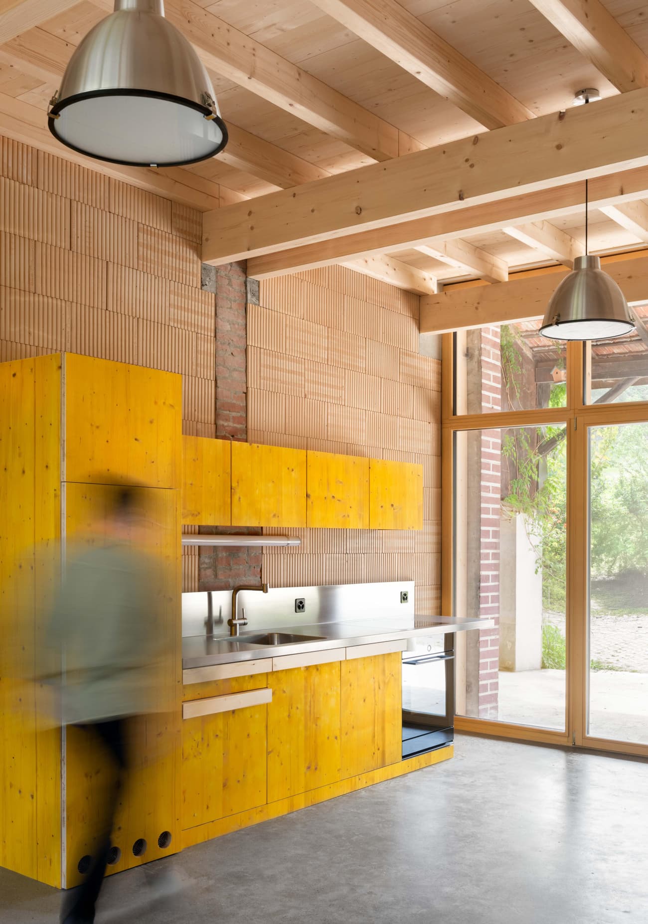 Architectural project - silver, workshop vibe, industrial kitchen, brick wall, modern loft, pendant lighting, urban industrial, modern appliances, custom cabinetry, vibrant kitchen, new build, cozy interior, warm interior, wood, timber, raw materials, city living, natural light, sustainable design, yellow, warm tones, contemporary style, grey, neutral tones, exposed beams, daylight, industrial vibe, concrete, multifunctional space, eco friendly, compact space, simple design, minimalist style, urban design, industrial chic, indoor outdoor, timber ceiling, home kitchen, open layout, open plan, terracotta wall, terracotta, bright interior, modern kitchen, wood ceiling, concrete floor, renovation, urban home