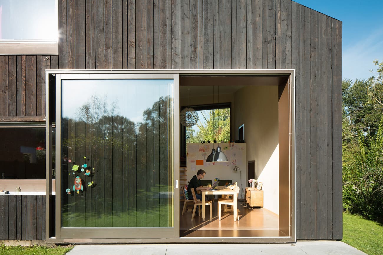 Architectural project - minimal design, cozy interior, indoor space, natural materials, wood, timber, grey, natural light, passive design, glass, contemporary architecture, green, daylight, beige, wood facade, timber facade, exterior design, eco friendly, black, Scandinavian vibe, workspace, eco home, indoor outdoor, white, Nordic style, large window, energy efficient, open plan, outdoor connection, garden view, green design, home office, multifunctional room, work from home, wooden cladding, family home, modern home, glass door, simple decor, compact living, playroom, sustainable living, sliding door, modern minimalist, private dwelling, dark wood, artistic space, children's area, creative corner, suburban house, architectural lines, sleek finish, garden access, versatile space, blackened timber, family area