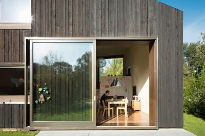 Architectural project - minimal design, cozy interior, indoor space, natural materials, wood, timber, grey, natural light, passive design, glass, contemporary architecture, green, daylight, beige, wood facade, timber facade, exterior design, eco friendly, black, Scandinavian vibe, workspace, eco home, indoor outdoor, white, Nordic style, large window, energy efficient, open plan, outdoor connection, garden view, green design, home office, multifunctional room, work from home, wooden cladding, family home, modern home, glass door, simple decor, compact living, playroom, sustainable living, sliding door, modern minimalist, private dwelling, dark wood, artistic space, children's area, creative corner, suburban house, architectural lines, sleek finish, garden access, versatile space, blackened timber, family area