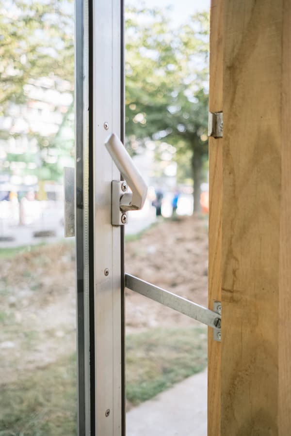 Architectural project - silver, metal elements, open door, exterior architecture, relaxing vibe, wood elements, wood, timber, urban setting, metal frame, steel, metal, timber frame, natural light, sustainable design, glass, warm tones, eco design, contemporary style, green, neutral tones, daylight, beige, eco friendly, modern design, simple design, minimalist design, structural detail, green architecture, clean lines, indoor outdoor, outdoor view, wood frame, energy efficient, inviting entrance, outdoor connection, landscape design, garden view, garden landscape, sleek design, glass door, urban nature, natural surroundings, outdoor greenery