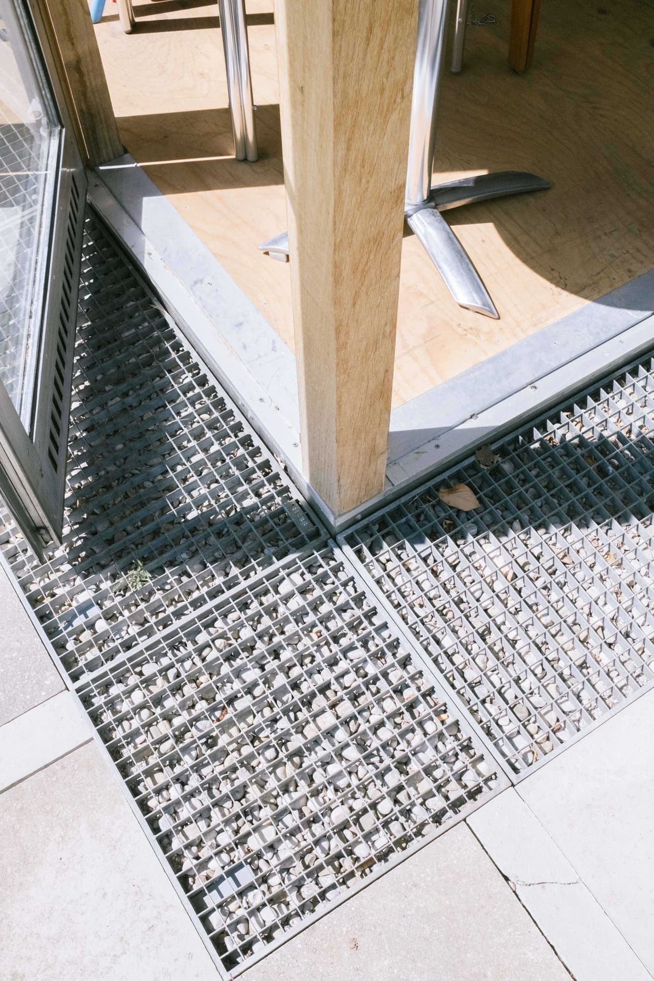 Architectural project - silver, silver accents, steel texture, natural elements, transitional space, terrace design, outdoor flooring, patio design, contemporary look, grid texture, minimal design, architectural detail, sustainable materials, wood, timber, raw materials, steel, metal, natural light, eco-conscious, grey, daylight, industrial vibe, geometric pattern, light wood, industrial style, functional design, modern simplicity, industrial touch, outdoor seating, steel frame, urban design, light tones, wood texture, open air, blond wood, simple lines, mixed materials, modern outdoor