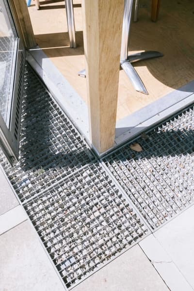 Architectural project - silver, silver accents, steel texture, natural elements, transitional space, terrace design, outdoor flooring, patio design, contemporary look, grid texture, minimal design, architectural detail, sustainable materials, wood, timber, raw materials, steel, metal, natural light, eco-conscious, grey, daylight, industrial vibe, geometric pattern, light wood, industrial style, functional design, modern simplicity, industrial touch, outdoor seating, steel frame, urban design, light tones, wood texture, open air, blond wood, simple lines, mixed materials, modern outdoor