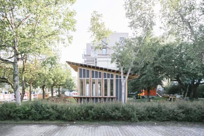 Architectural project - urban greenery, garden pavilion, gathering place, light-filled interior, angled roof, community area, natural materials, eco-friendly design, wood, timber, steel, outdoor space, natural light, passive design, glass, warm tones, green building, contemporary style, urban park, sustainable architecture, grey, green, neutral tones, daylight, landscape architecture, brown, timber facade, light wood, modern design, public space, park setting, lightweight structure, biophilic design, timber cladding, sloped roof, canopy roof, environmental design, nature integration, small pavilion, eco architecture, minimalist aesthetic, wooden cladding, open space, low carbon building, glass facade, eco conscious design