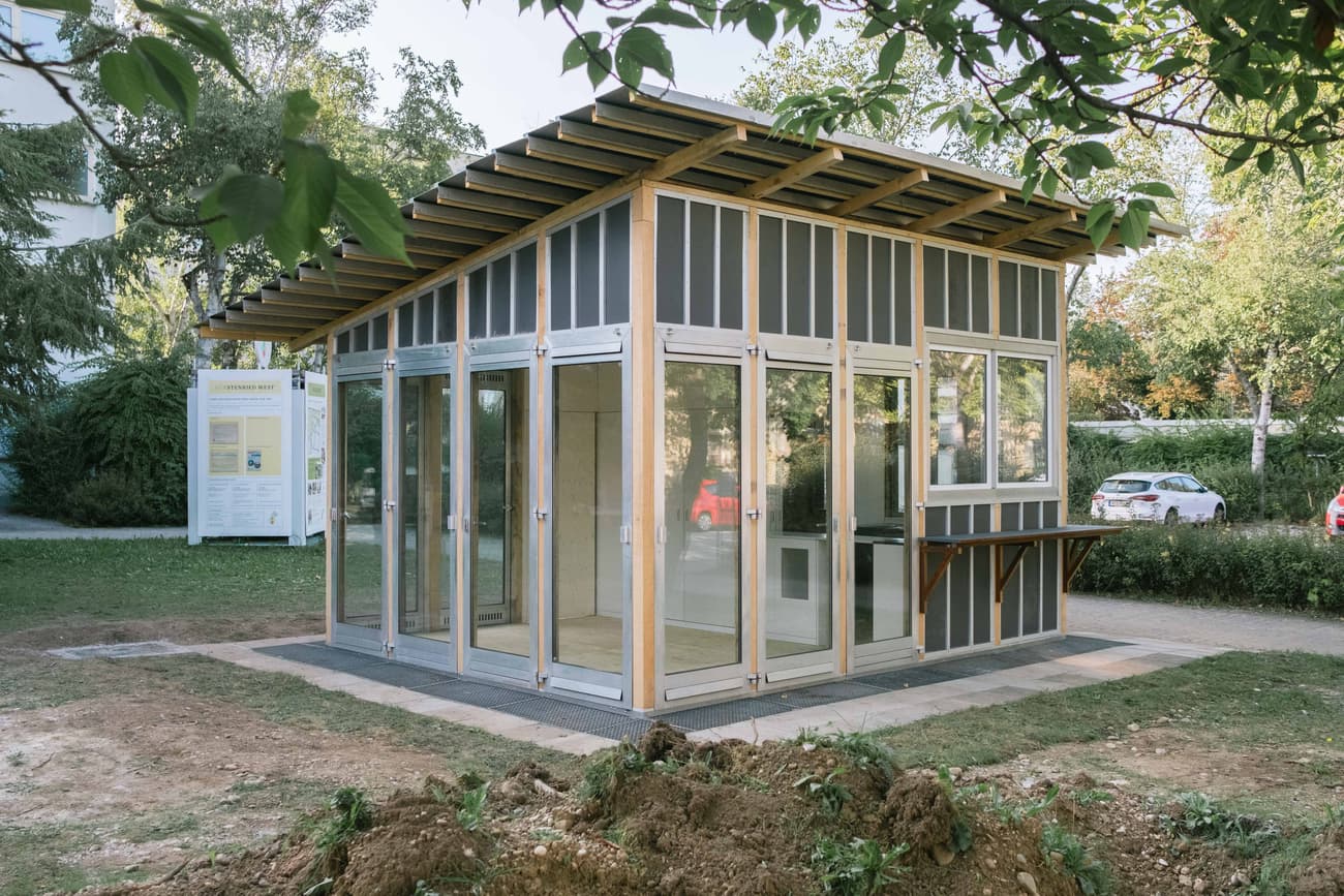 Architectural project - minimal intervention, flexible space, prefabricated, transparent facade, garden structure, gathering spot, transparent, garden setting, eco pavilion, eco-friendly design, wood, timber, outdoor space, timber frame, natural light, passive design, glass, modular design, green building, community space, simple structure, green, light wood, low carbon design, open design, urban oasis, contemporary design, outdoor pavilion, wood construction, modern pavilion, sustainable building, natural ventilation, wood frame, energy efficient, compact design, glass walls, inviting space, small pavilion, urban garden