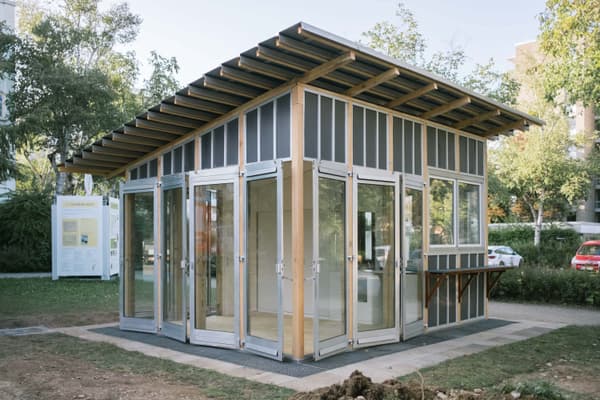 Architectural project - metal cladding, workshop space, grey facade, compact building, garden pavilion, meeting room, light atmosphere, study room, eco pavilion, sustainable materials, timber frame, natural light, passive design, recycled materials, modular design, eco design, community space, renewable materials, neutral tones, daylight, light wood, eco friendly, simple design, honey wood, contemporary design, minimalist style, outdoor pavilion, prefabricated structure, flexible use, steel structure, adaptable space, modern pavilion, sustainable building, eco construction, green architecture, low carbon, natural ventilation, wood frame, airy space, small structure, bright space, educational space, urban garden, glass facade, vertical panels