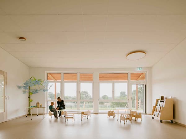 Architectural project - sustainable space, indoor play, wooden toys, airy room, inviting, spacious, educational environment, warm interior, natural materials, eco-friendly design, wood, natural light, community space, neutral tones, daylight, beige, light wood, Scandinavian style, neutral palette, minimalist design, social space, interactive space, multifunctional, creative space, large windows, white, Nordic design, cozy vibe, open layout, family space, child friendly, bright interior, calm atmosphere, simple decor, open space, educational space, playroom, learning environment, family area
