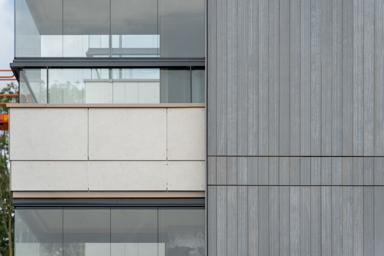 Architectural project - terrace, urban residential, floor to ceiling windows, metal cladding, light grey, ventilated facade, eco-friendly design, sustainable materials, city living, metal, cityscape, natural light, passive design, glass, neutral tones, concrete, minimalist facade, low carbon design, daylight optimization, glass panels, contemporary design, modern aesthetics, sustainable building, modern facade, clean lines, large windows, modern architecture, urban architecture, vertical cladding, facade rhythm, sleek exterior, glass facade, building envelope, architectural contrast, reflective glass, residential facade, eco facade, urban vibe
