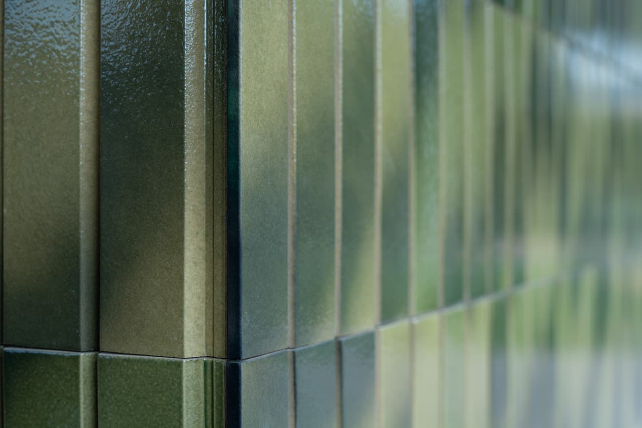 Architectural project - exterior tiles, green facade, texture, green tiles, vertical tiles, linear pattern, glazed tiles, material mix, glossy tiles, textured tiles, green, exterior design, minimalist facade, geometric pattern, exterior wall, contemporary design, modern facade, modern architecture, facade design, tiles, ceramic, ceramic tiles, exterior cladding