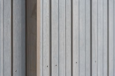 Architectural project - linear design, simple aesthetic, exterior architecture, exterior finish, facade cladding, outdoor cladding, streamlined look, architectural detail, grey tones, eco design, neutral tones, timber facade, geometric pattern, light wood, weathered wood, contemporary design, Scandinavian style, minimalist design, natural finish, timber panels, natural material, textured surface, modern facade, clean lines, wood cladding, harmonious design, modern architecture, sustainable material, wooden texture, sleek design, wood siding, nordic influence, pale wood, vertical panels, timber finish