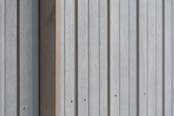 Architectural project - linear design, simple aesthetic, exterior architecture, exterior finish, facade cladding, outdoor cladding, streamlined look, architectural detail, grey tones, eco design, neutral tones, timber facade, geometric pattern, light wood, weathered wood, contemporary design, Scandinavian style, minimalist design, natural finish, timber panels, natural material, textured surface, modern facade, clean lines, wood cladding, harmonious design, modern architecture, sustainable material, wooden texture, sleek design, wood siding, nordic influence, pale wood, vertical panels, timber finish